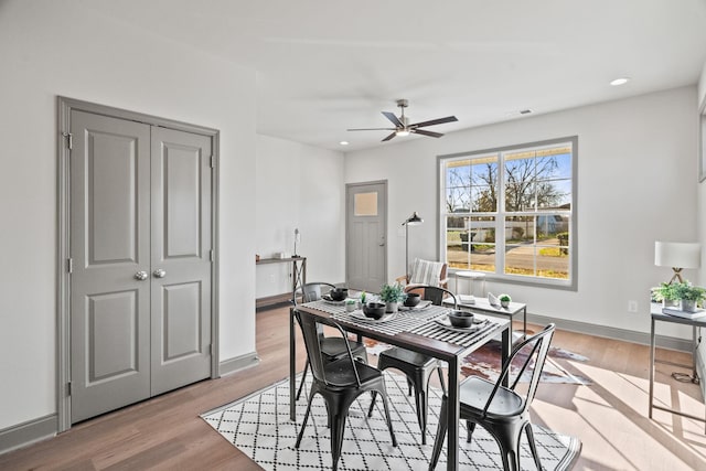 dining area featuring ceiling fan and light hardwood / wood-style flooring