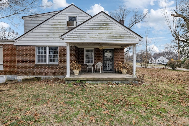 view of front of home featuring a front yard and covered porch