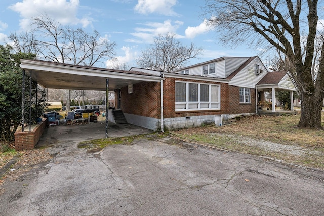 view of home's exterior with a carport