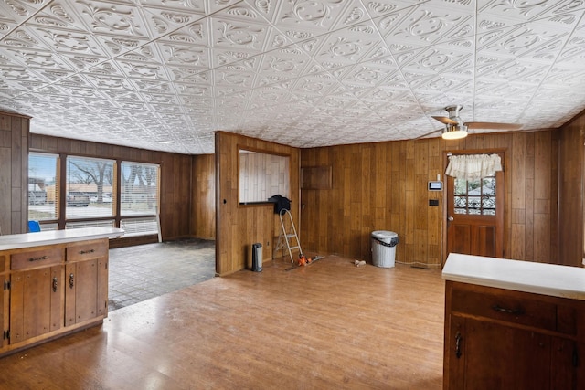 interior space featuring wooden walls and light hardwood / wood-style floors