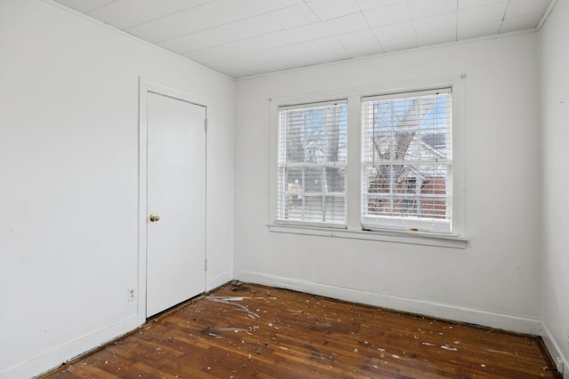 spare room featuring dark wood-type flooring