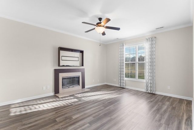 unfurnished living room with hardwood / wood-style flooring, ceiling fan, and crown molding