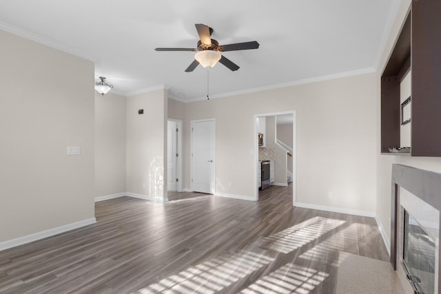 unfurnished living room with ceiling fan, dark hardwood / wood-style floors, and ornamental molding