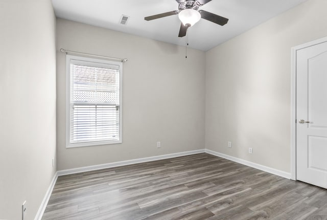 spare room featuring ceiling fan and light wood-type flooring