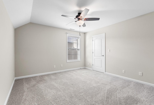 unfurnished room with ceiling fan, light colored carpet, and lofted ceiling