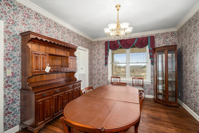 dining space featuring dark hardwood / wood-style flooring, crown molding, and an inviting chandelier