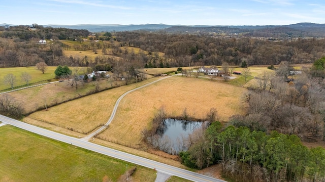 birds eye view of property featuring a rural view and a water view