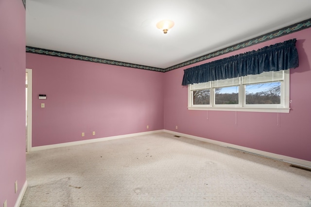 unfurnished room with carpet floors