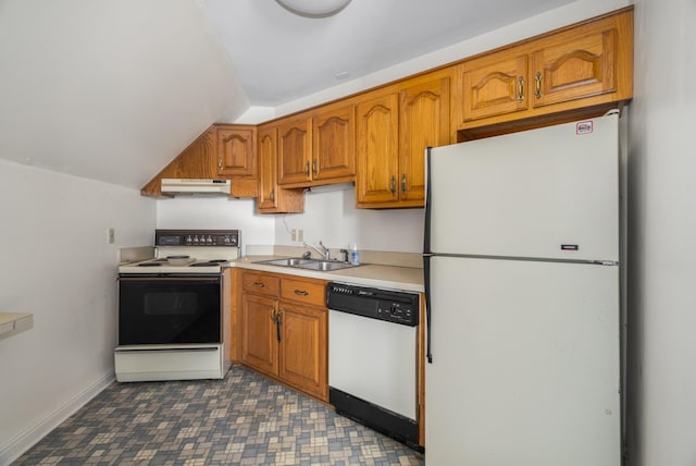 kitchen with white appliances, sink, and vaulted ceiling