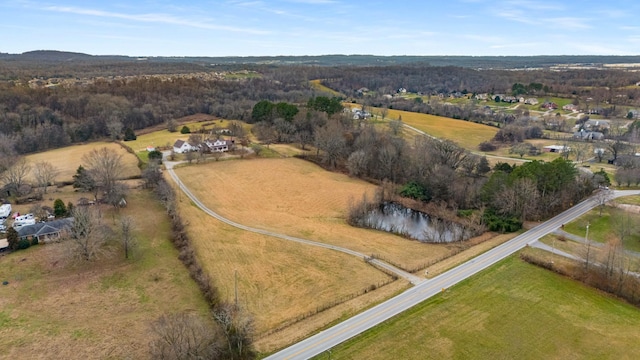 birds eye view of property featuring a rural view