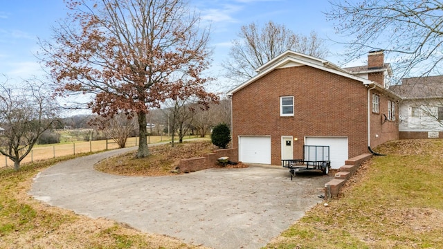 view of side of property with a garage