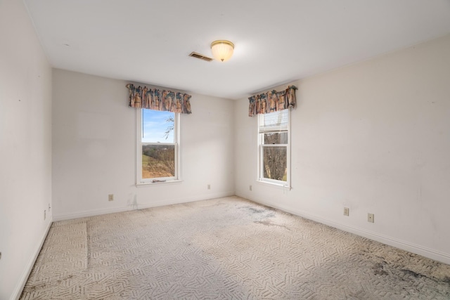 unfurnished room featuring carpet flooring