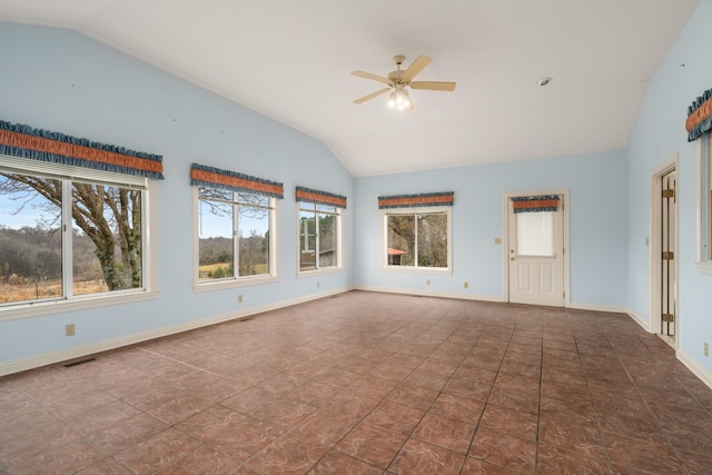 unfurnished room with dark tile patterned flooring, ceiling fan, and lofted ceiling