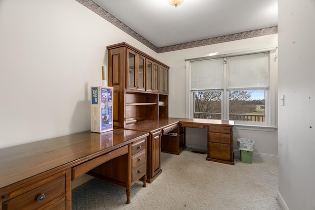 office area with light carpet and built in desk