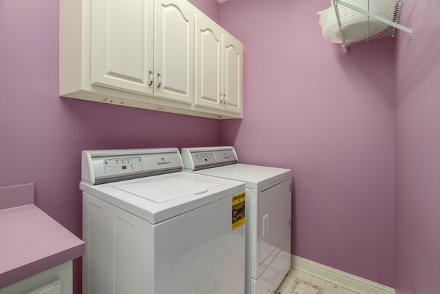 laundry area with cabinets and independent washer and dryer