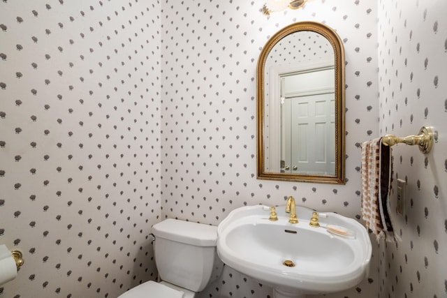 bathroom featuring sink and toilet