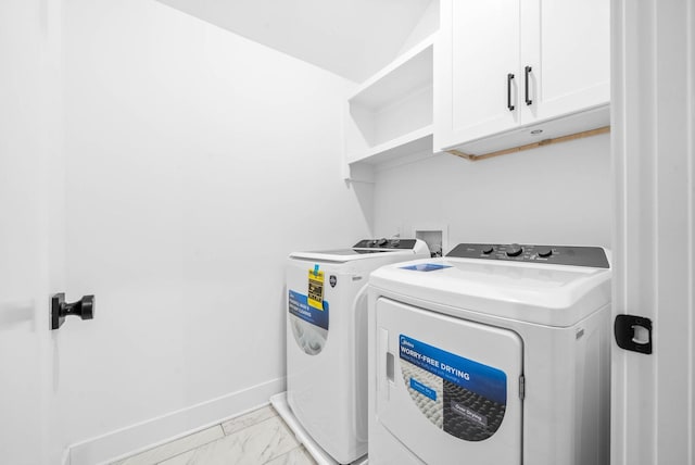 laundry room featuring cabinets and independent washer and dryer