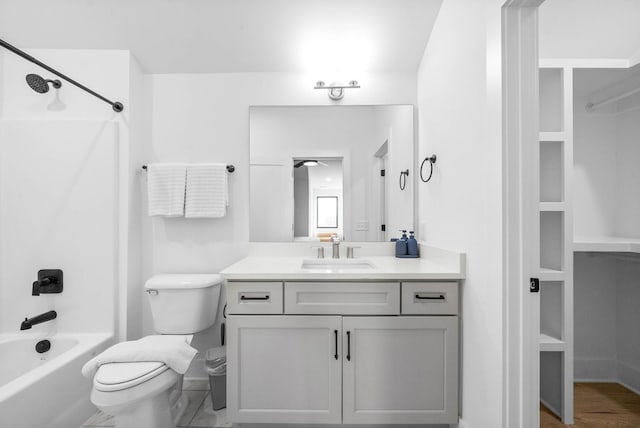 full bathroom featuring shower / bathing tub combination, vanity, and toilet