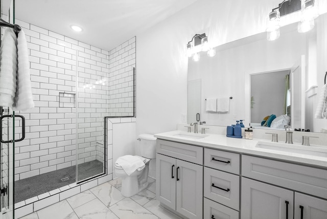 bathroom with vanity, an enclosed shower, and toilet