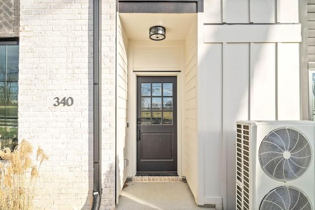 view of exterior entry featuring ac unit