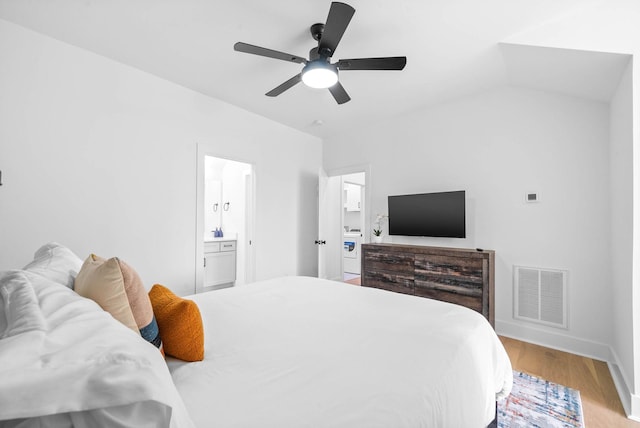 bedroom with connected bathroom, light hardwood / wood-style floors, and ceiling fan