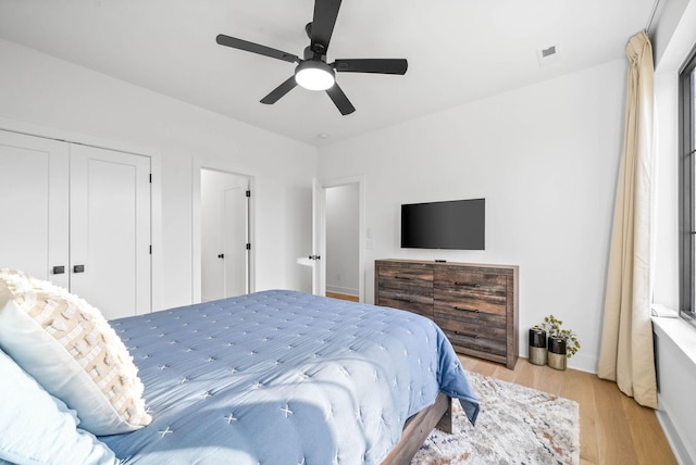 bedroom featuring ceiling fan and light wood-type flooring