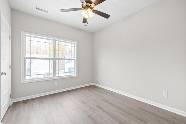 spare room featuring ceiling fan and light hardwood / wood-style flooring