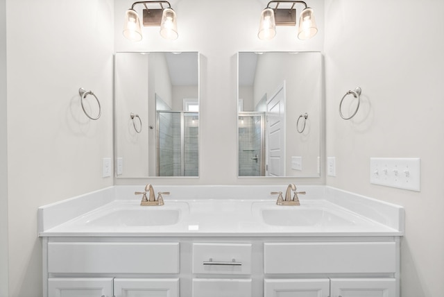 bathroom featuring vanity and a shower with shower door