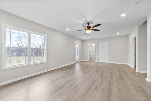 unfurnished room with light wood-type flooring and ceiling fan