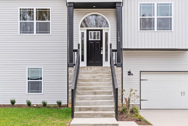 property entrance with a garage