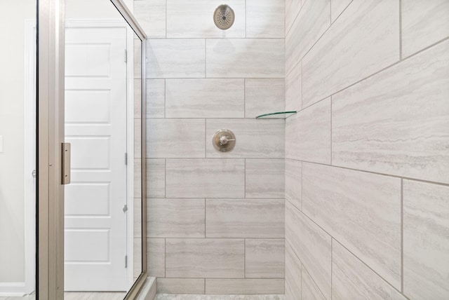 bathroom with tiled shower