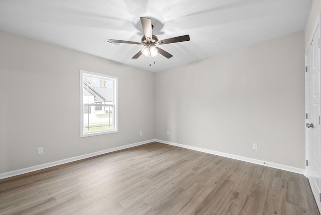 unfurnished room featuring light hardwood / wood-style flooring and ceiling fan