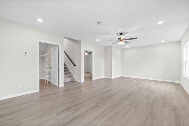 unfurnished living room with ceiling fan and light hardwood / wood-style floors