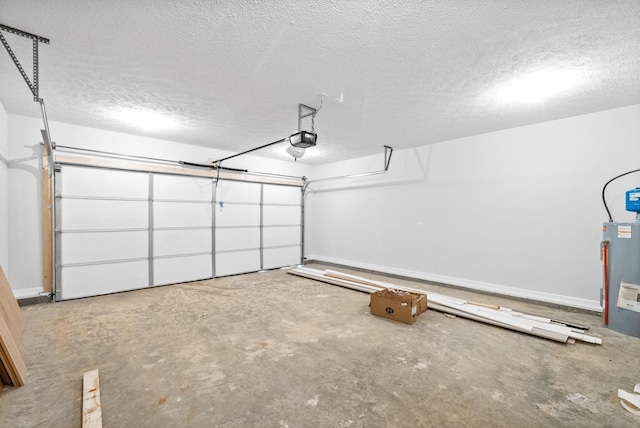 garage featuring water heater and a garage door opener