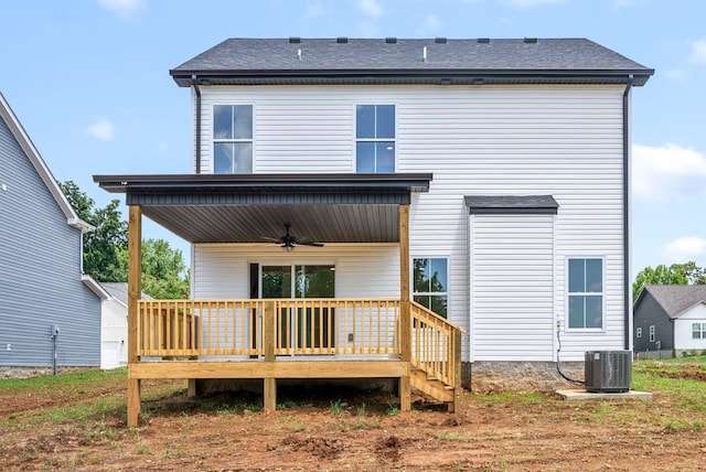 rear view of property featuring central AC and ceiling fan