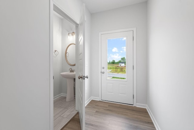 doorway to outside with light hardwood / wood-style floors