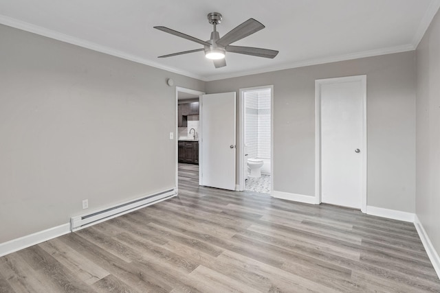 unfurnished bedroom with light wood-type flooring, ornamental molding, baseboard heating, ceiling fan, and sink