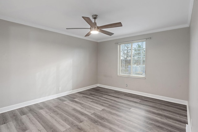 unfurnished room with hardwood / wood-style flooring, ceiling fan, and crown molding