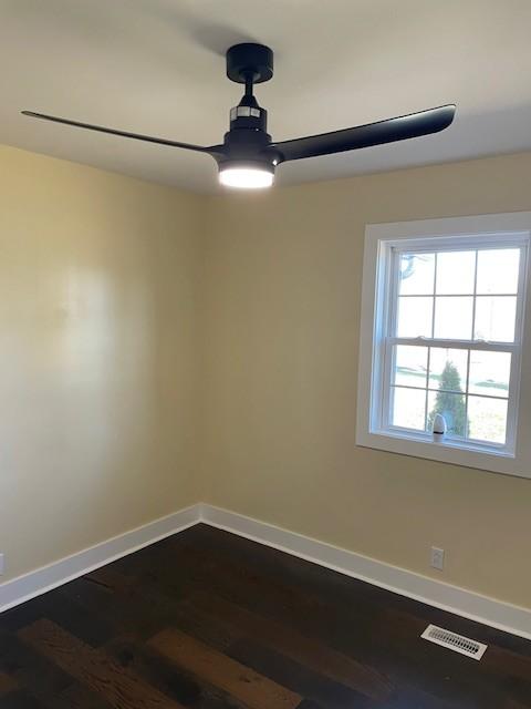 unfurnished room with wood-type flooring