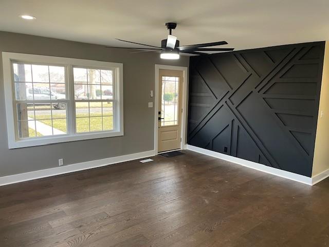 foyer entrance featuring dark hardwood / wood-style flooring and ceiling fan