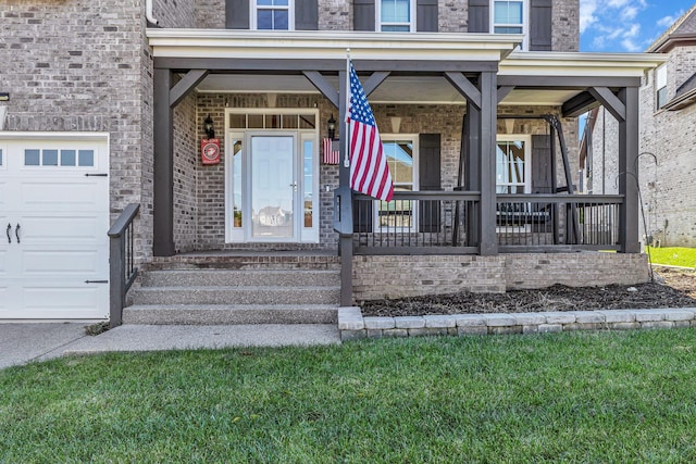 entrance to property with covered porch and a garage