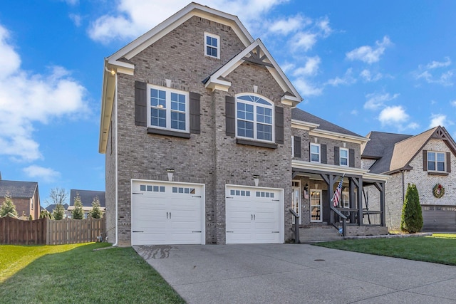 view of front of house with a front yard and a garage