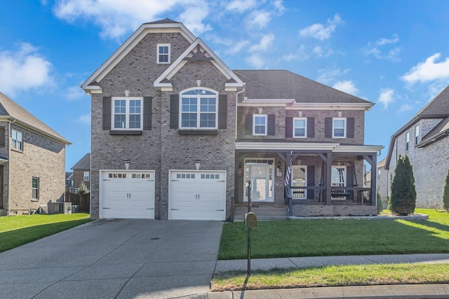 view of front of property featuring a front lawn, covered porch, and a garage