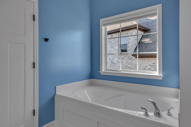 bathroom featuring a tub to relax in