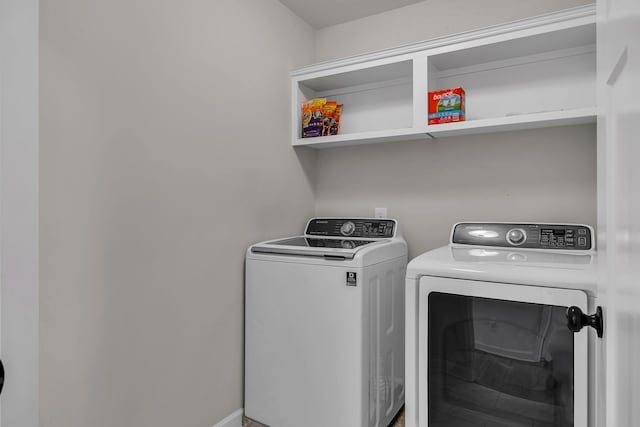 washroom with washer and clothes dryer