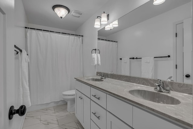 full bathroom featuring vanity, toilet, and shower / tub combo with curtain