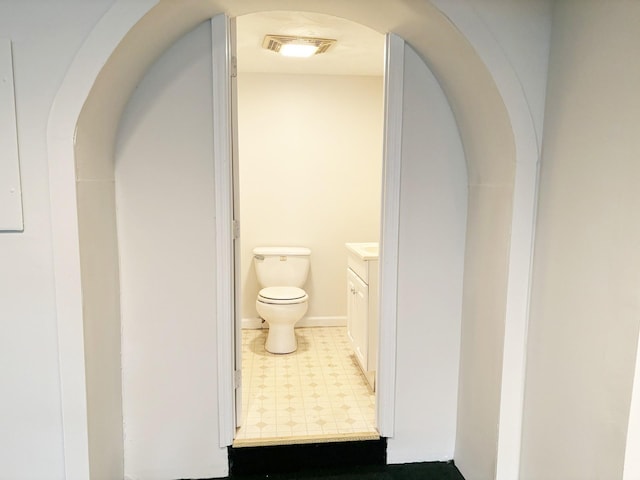 bathroom with vanity and toilet