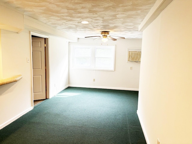 carpeted spare room featuring a wall mounted AC, ceiling fan, and a textured ceiling