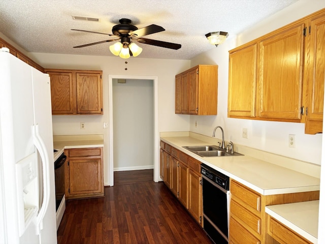 kitchen featuring dishwasher, white fridge with ice dispenser, dark wood-type flooring, sink, and a textured ceiling