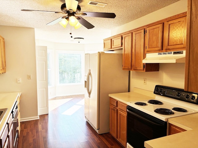 kitchen featuring a textured ceiling, ceiling fan, dark wood-type flooring, and white appliances